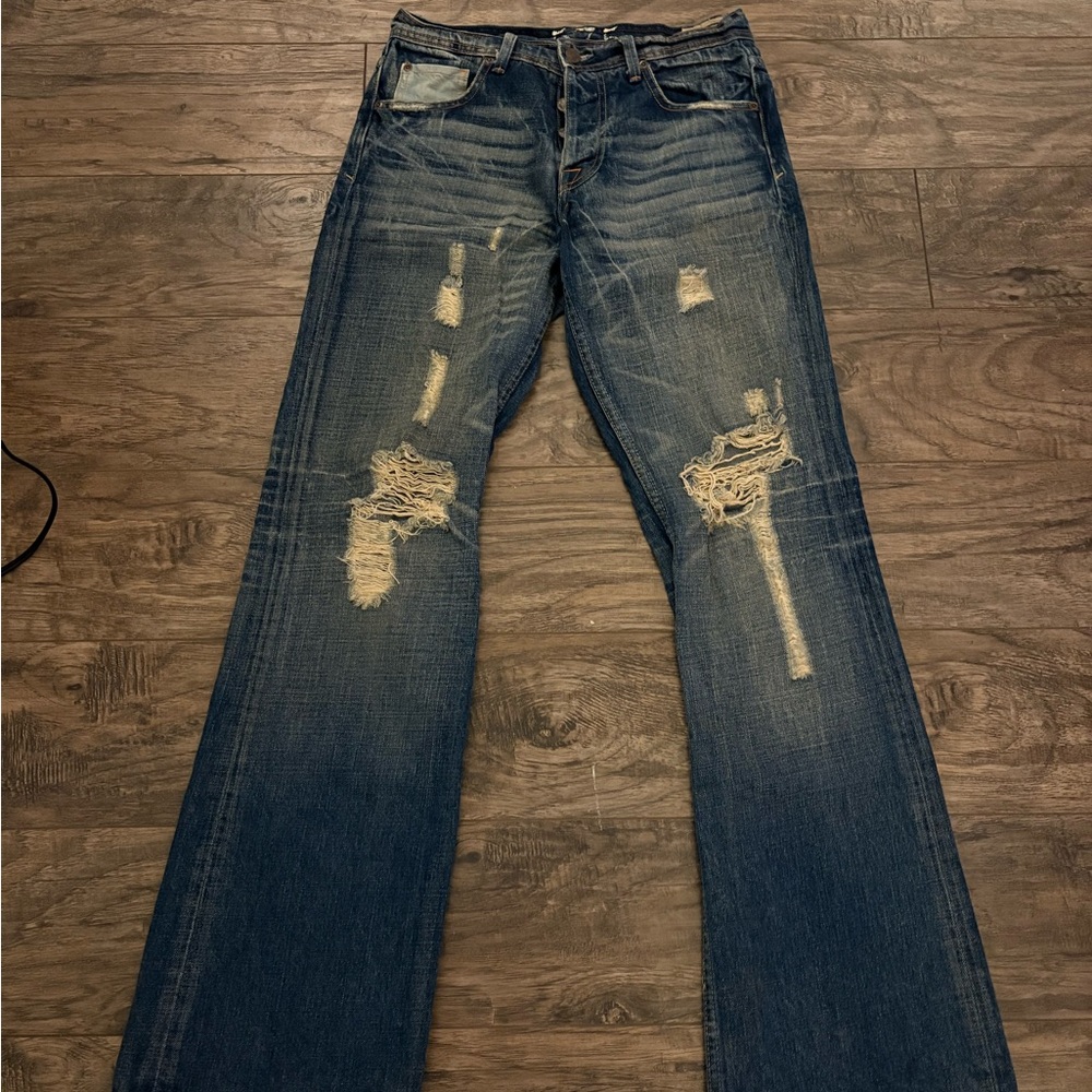575 Ripped flared jeans